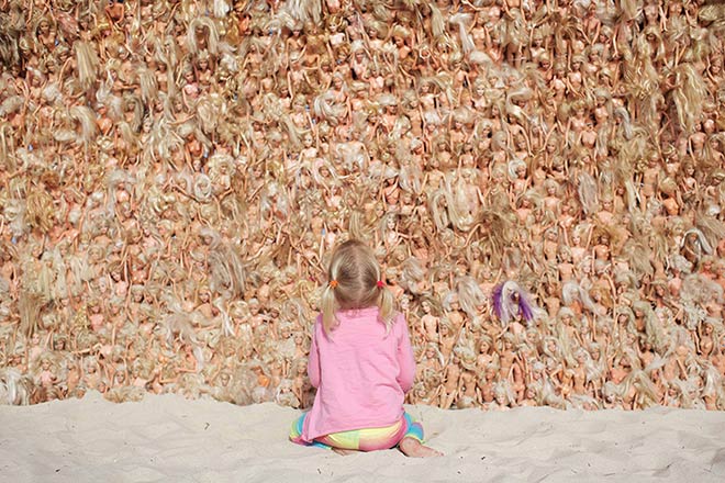 the barbie wave towers over the child photo by jarred seng / courtesy of sculpture by the sea