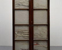 Doris Salcedo - Untitled, 1998. Wooden cabinet, concrete, steel, and clothing, 72 1/4 x 39 x 13 in. (183.5 x 99.5 x 33 cm). Collection of Lisa and John Miller, fractional and promised gift to the San Francisco Museum of Modern Art. Photo: David Heald. Reproduced courtesy of the artist; Alexander and Bonin, New York; and White Cube, London.