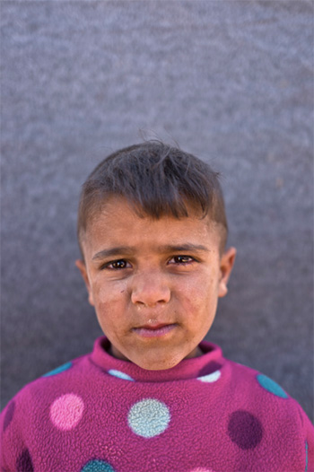 Muhammed Muheisen / AP Photo - Omar Suliman, 5 anni, viene da Hassakeh, Siria. La foto è stata scattata l'11 marzo in un campo profughi vicino al confine siriano nella periferia di Mafraq, Giordania.