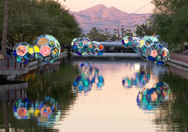 The Urban Conga - Molecules, Arizona Canal, Scottsdale, Arizona (USA). Reflections of Molecules on the Arizona Canal with the McDowell Mountain Range in the background. Photo credit: Andrew Pielage