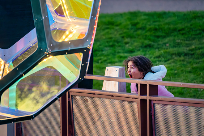 The Urban Conga - Molecules, Arizona Canal, Scottsdale, Arizona (USA). A young girl yells into the interactive microphone to see her voice bring Molecules to life and shift the lighting. Photo credit: Charles Darr