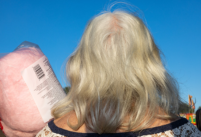 ©Lauren Stewart (United States) / Courtesy All About Photo. Title of the image: Cotton Candy. Title of the Series: South Carolina State Fair. Merit Award Gallery AAP Magazine 44: Street