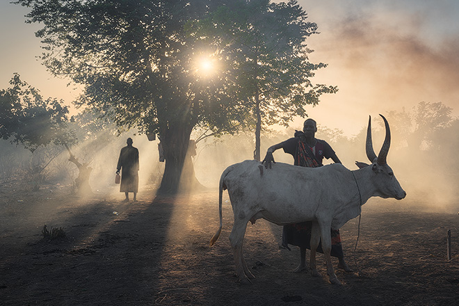 Chiara Felmini (ITA) / Courtesy All About Photo - In the sunset. Series: Sud Sudan – Dawn, dust and fire, Merit Award Gallery, AAP Magazine #45: Travels